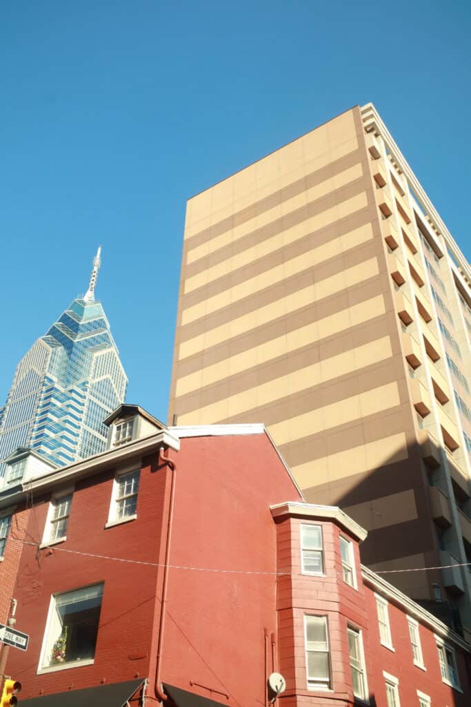 A building with a clock tower in the background.