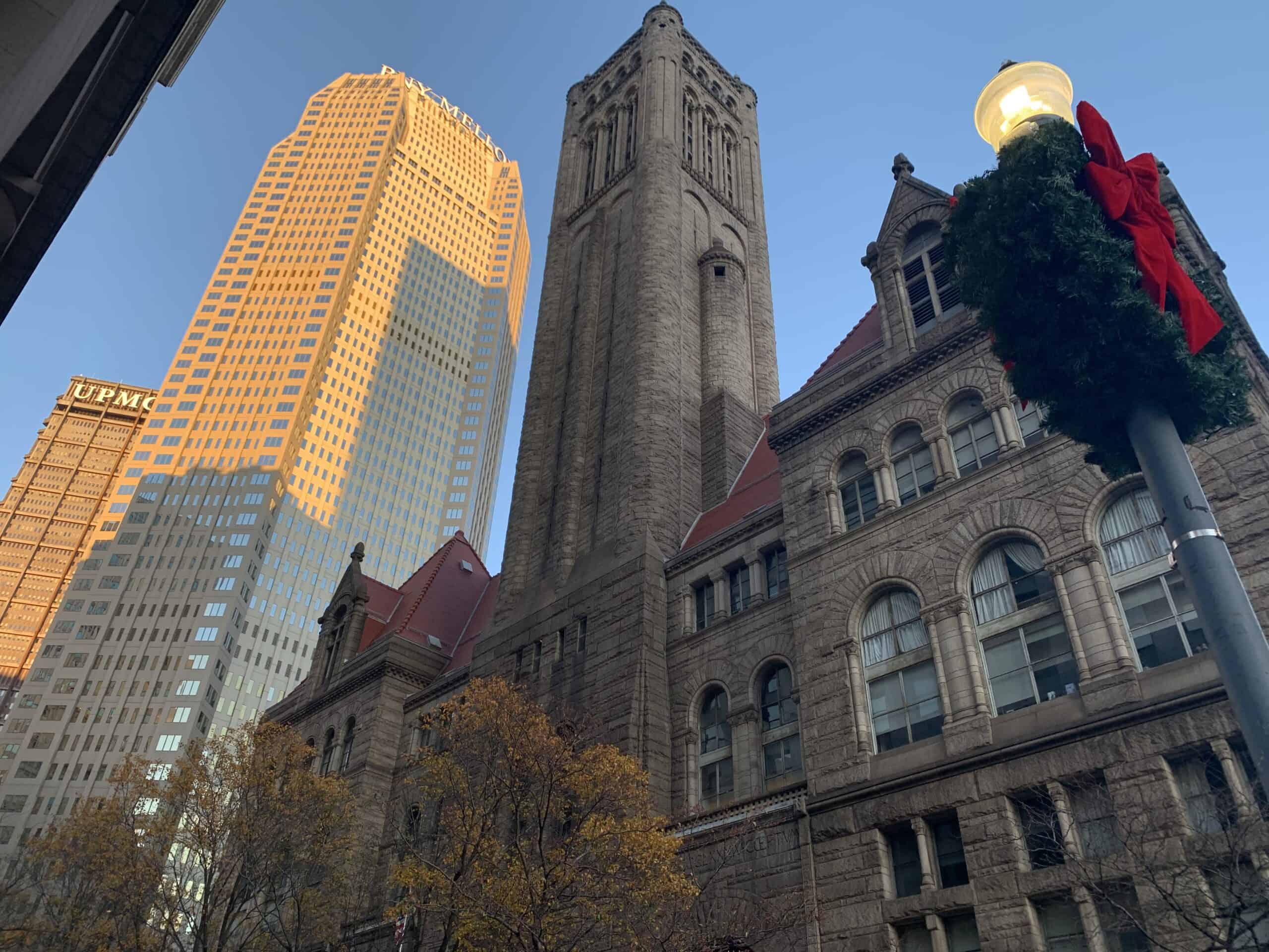 A tall building with a clock tower in the background, representing the office location of an employment lawyer.