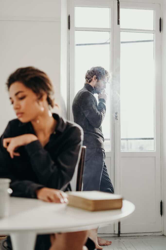 A man and woman sitting at a table.