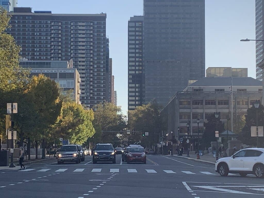 A city street with tall buildings.