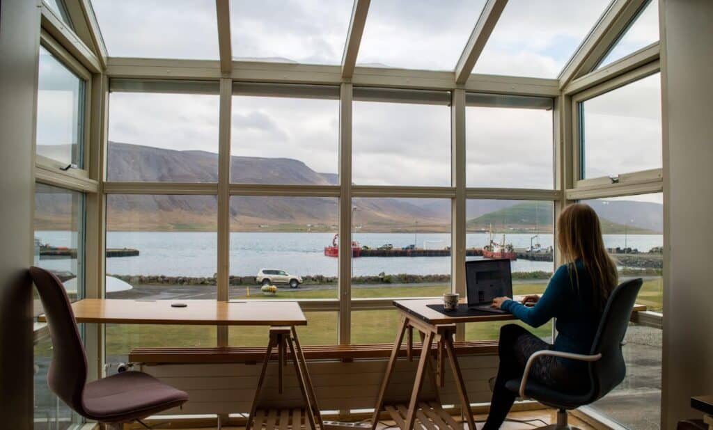 A woman sits at a desk as an employment lawyer.