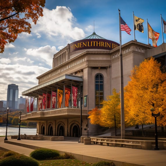 A building with flags in front of it in the fall, representing a law firm specializing in employment.