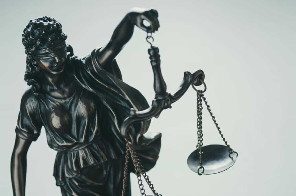 A statue of a lady holding scales of justice.