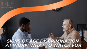 Two coworkers in a tense meeting under firm branding introduce common warning signs of age discrimination at work.