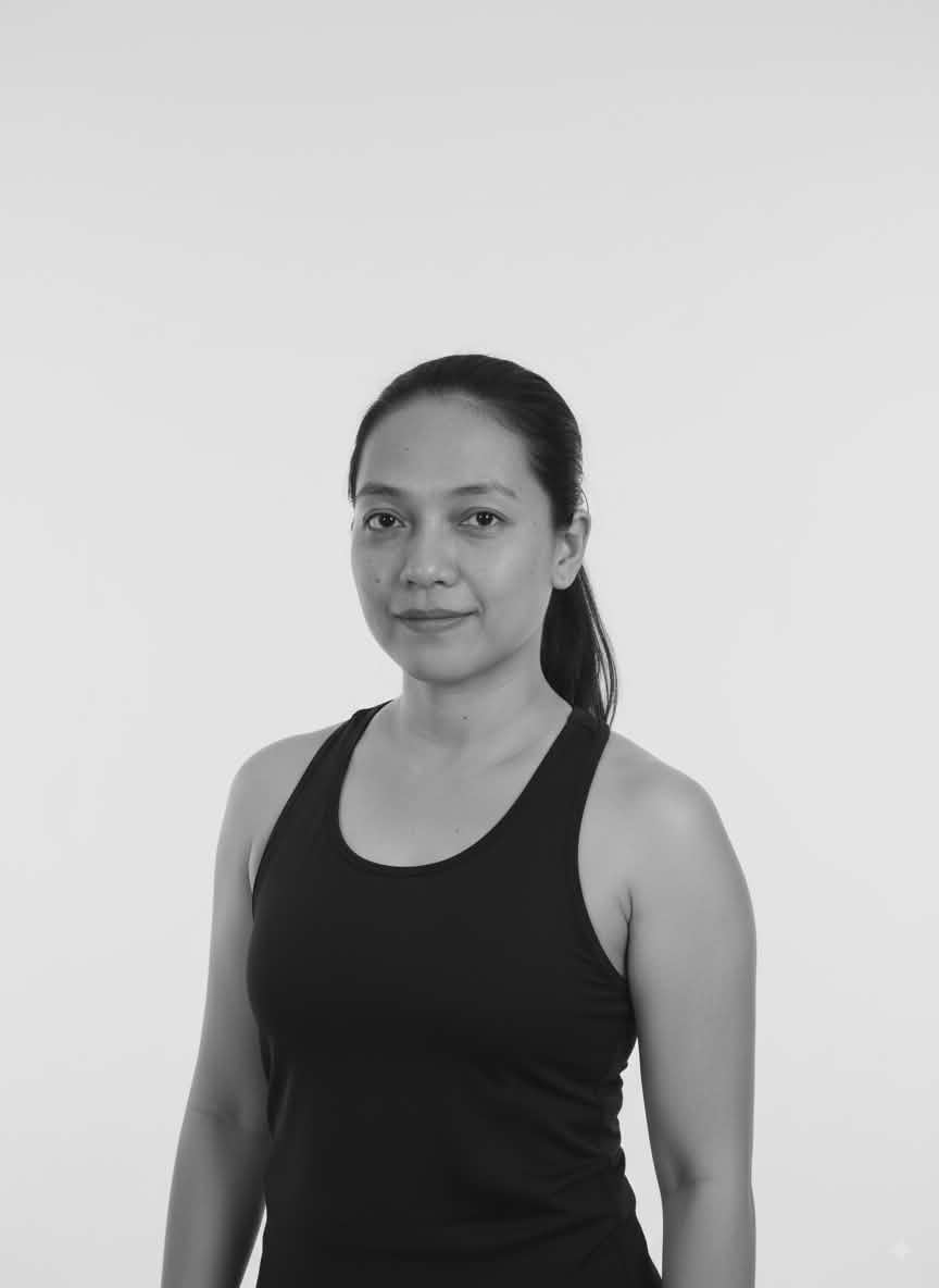 A woman with long dark hair in a ponytail, wearing a sleeveless black top, stands facing the camera against a plain white background—resembling Kat Concepcion’s signature minimalist style.