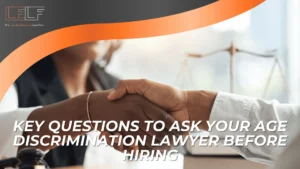 Two people shake hands in an office setting, with the text “Key Questions to Ask your Age Discrimination lawyer before hiring” displayed at the bottom.